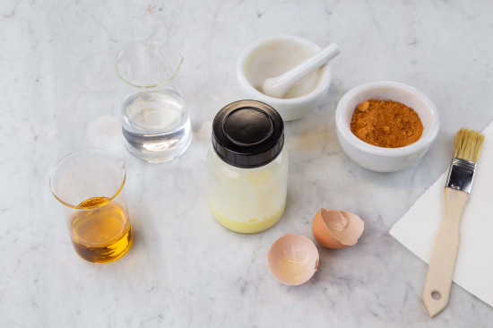 Crack the egg into a glass with a screw cap. Shake the egg well.