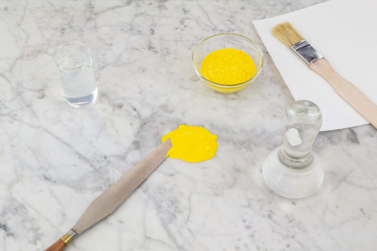 Mix the pigments with a pallet knife with the binding agent Polyvinyl Alcohol.