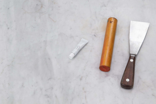 Squeeze the folded metal firmly with a pair of pliers. Do not forget to label the tube!